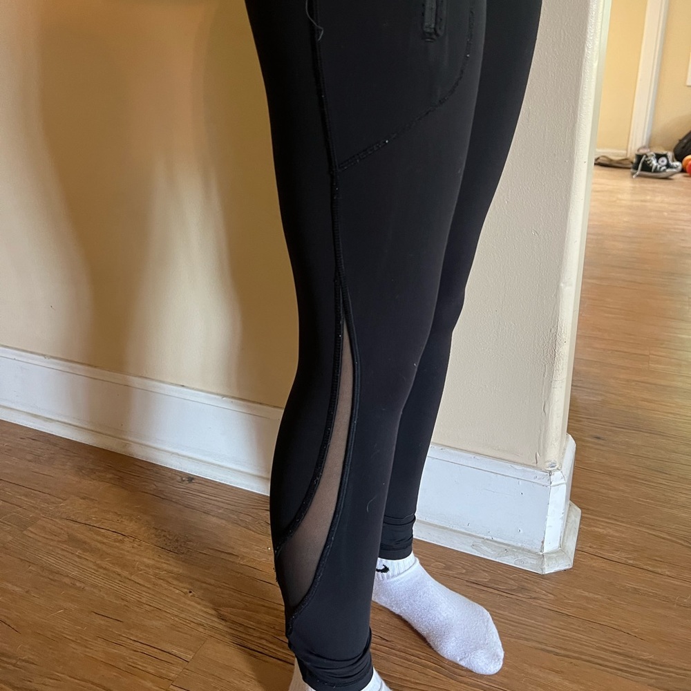 Lululemon size 2, pockets and mesh detailing. Good condition